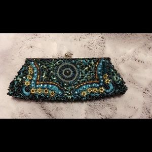 Small teal/aqua green clutch